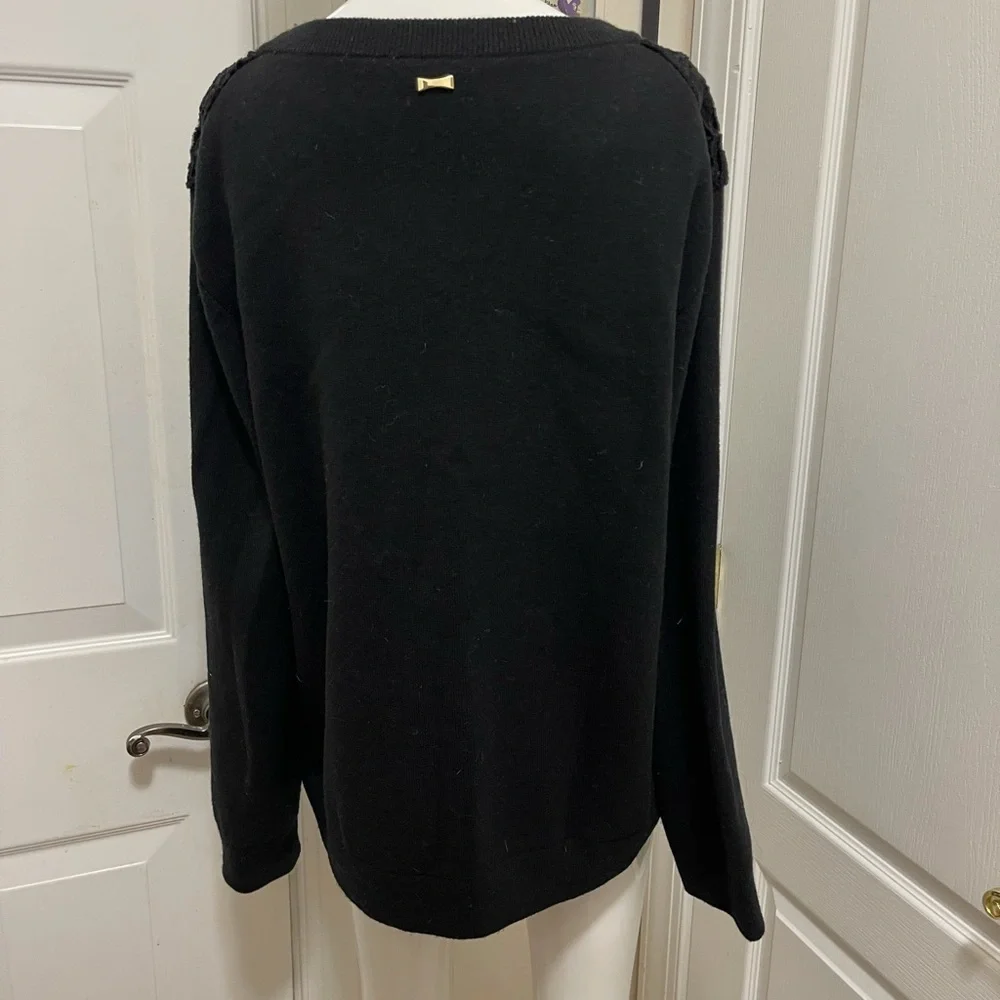Kate spade black sweater. Looks like Front made with the unique sheep fur.